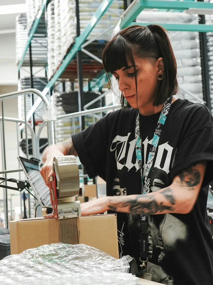 Woman packing an order for delivery