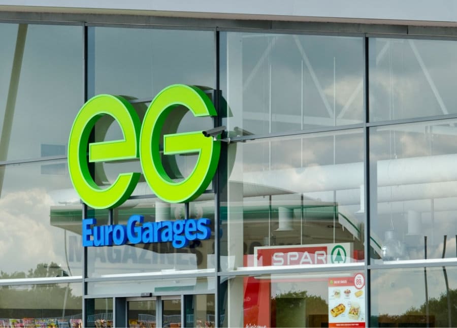 Green EG logo and Euro Garages sign on the glass front of a forecourt building