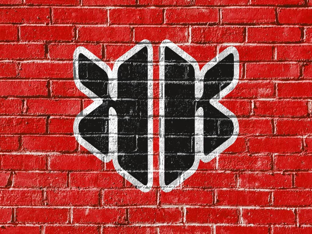 KershKicks logo painted on a red brick wall