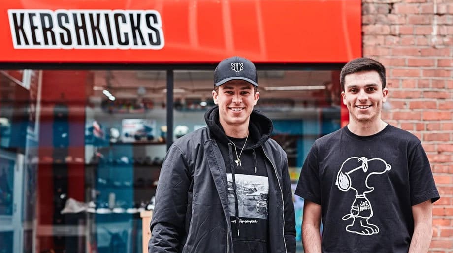 Two young men standing outside the KershKicks trainer shop